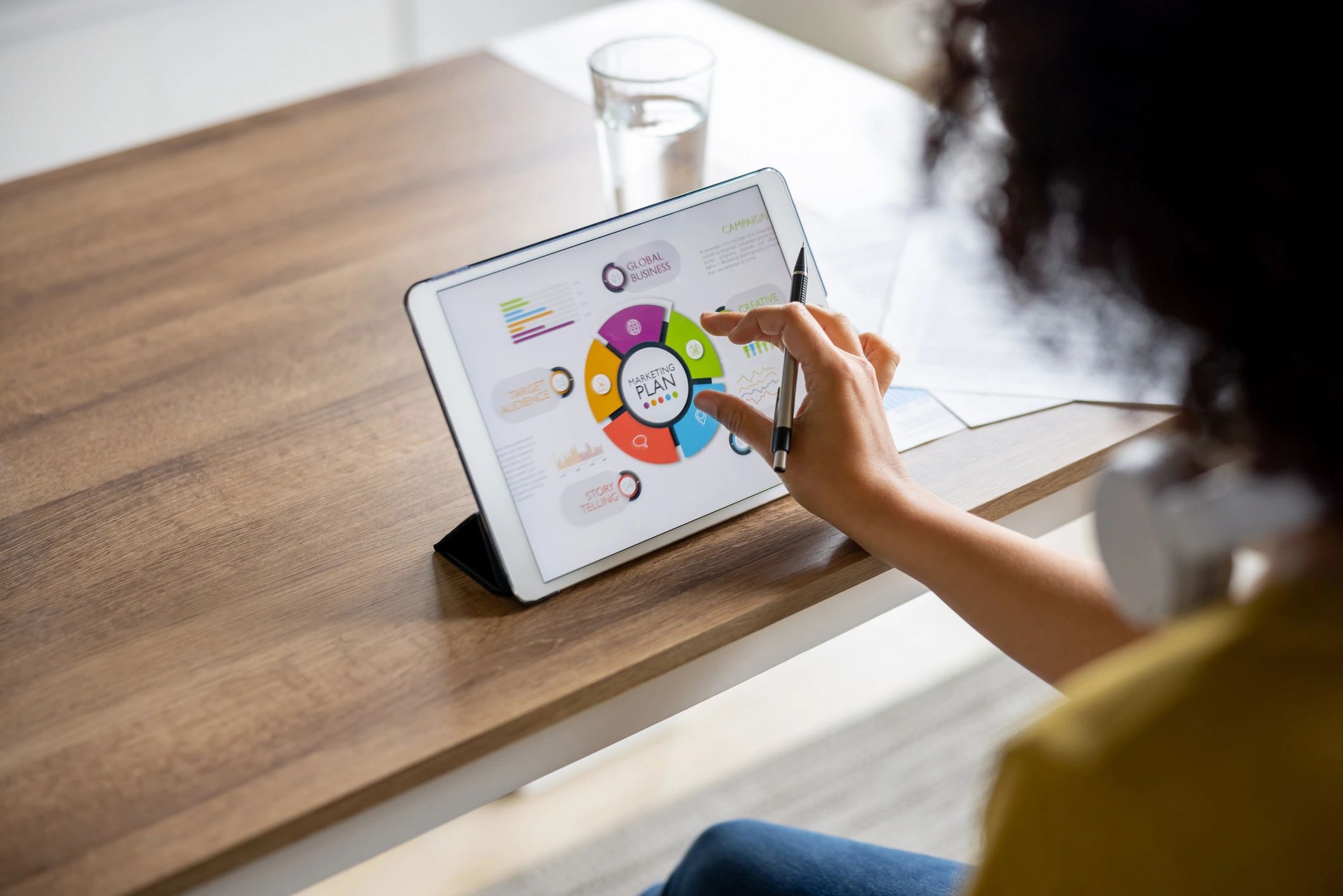 Marketing professional planning an email campaign on a tablet