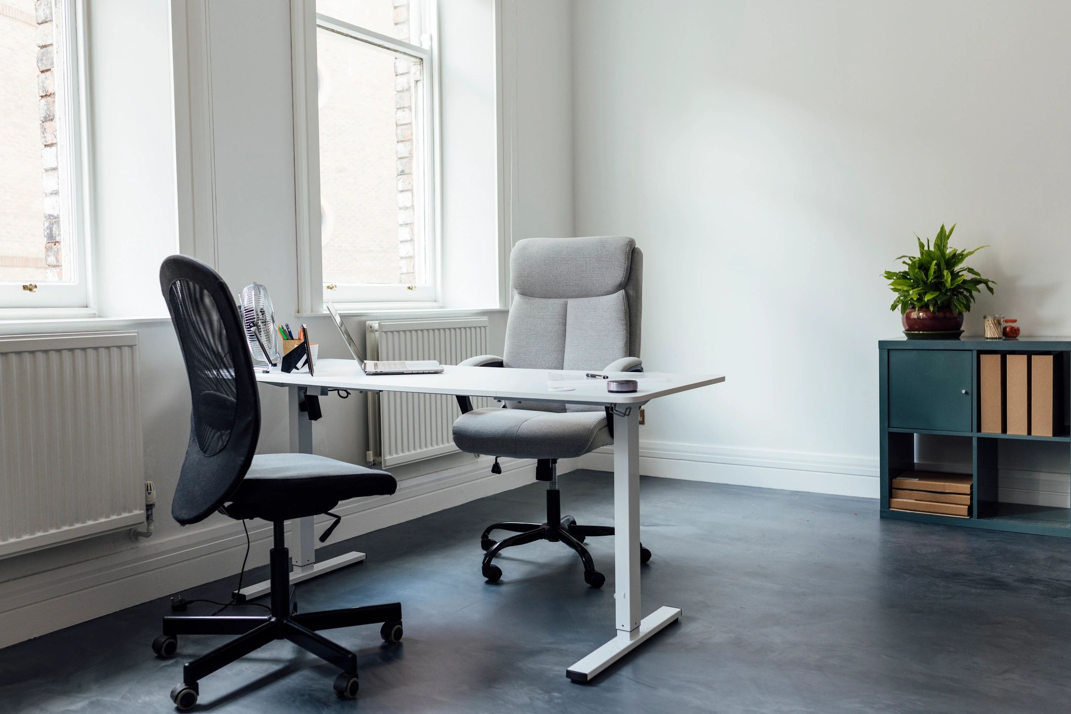 Modern creative agency workspace with desks and chairs