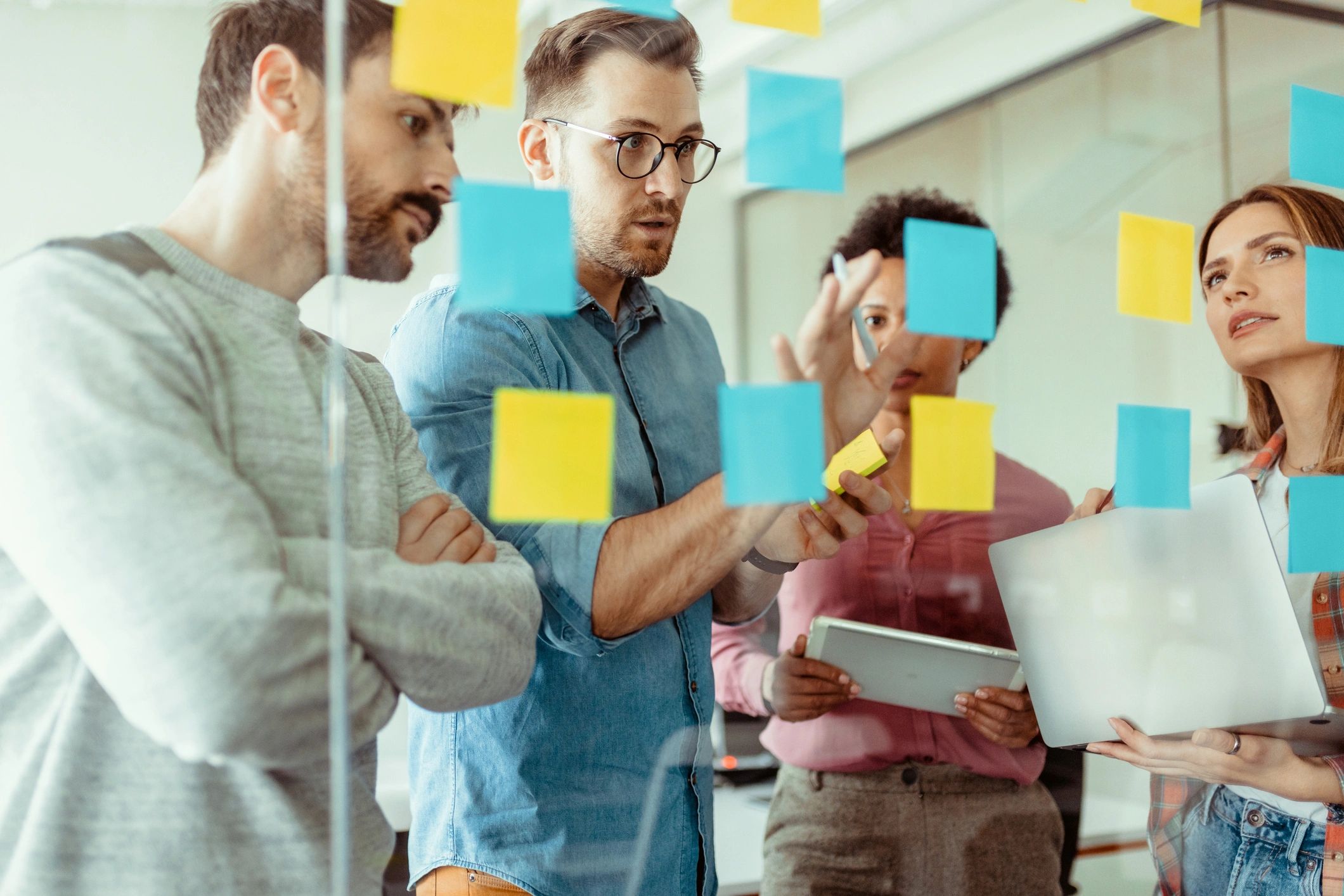 Creative team planning a website strategy with sticky notes