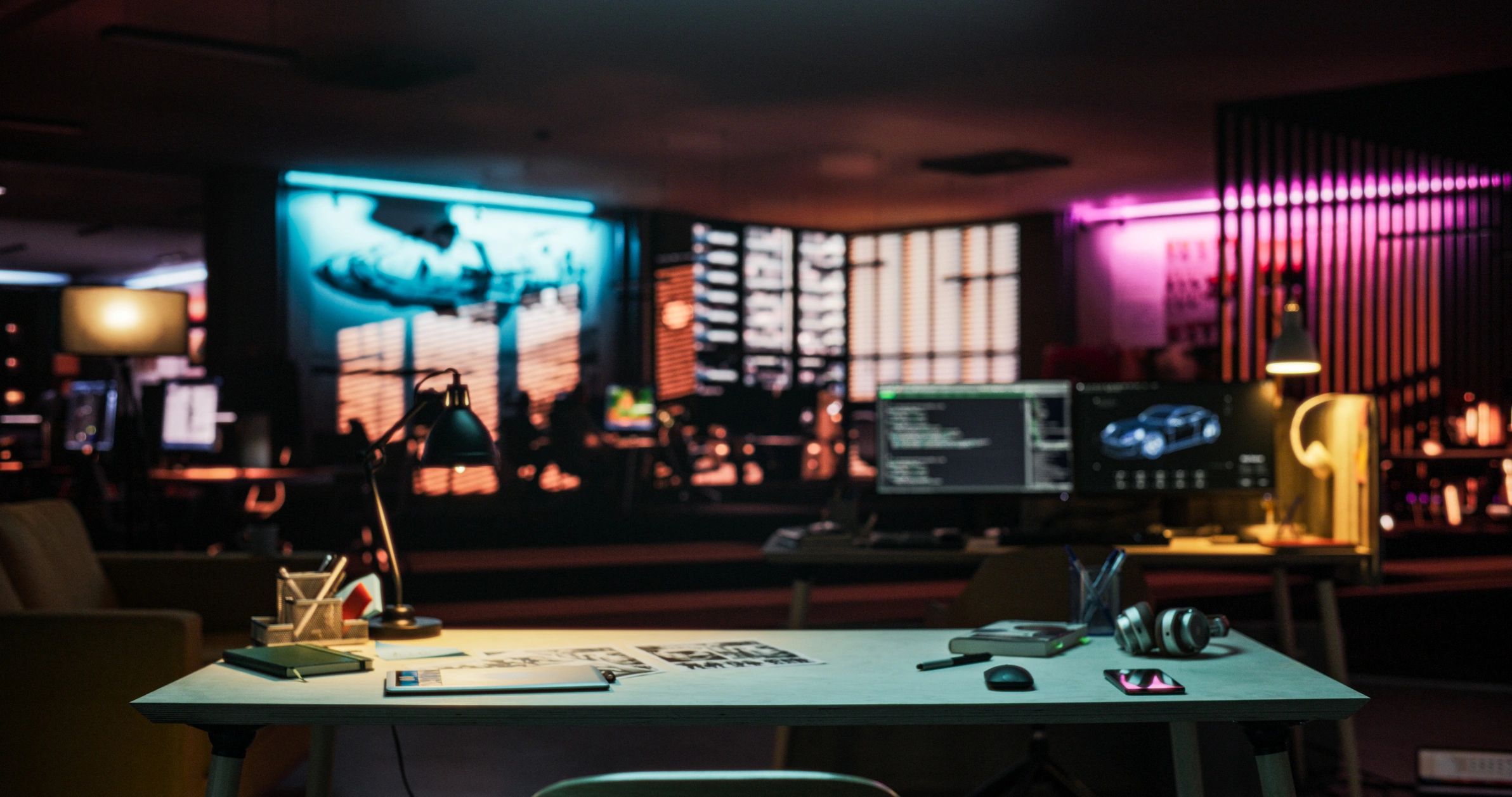 Creative workspace with laptop and notebook for brand planning